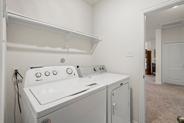 washroom featuring independent washer and dryer and light colored carpet