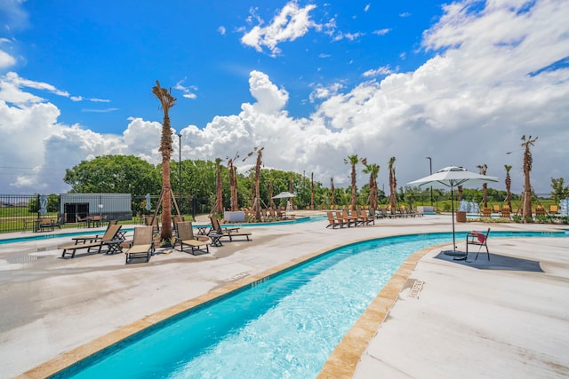 view of swimming pool featuring a patio area