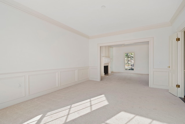 carpeted spare room featuring ornamental molding