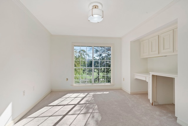 unfurnished dining area featuring crown molding and light colored carpet