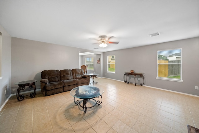 living room featuring ceiling fan and light tile patterned flooring