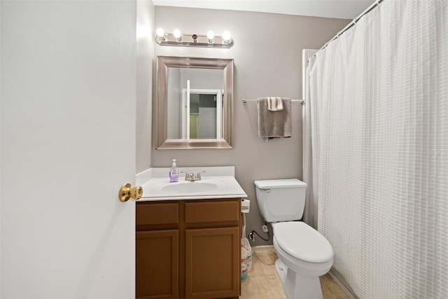 bathroom featuring vanity, hardwood / wood-style flooring, toilet, and curtained shower