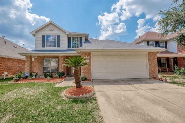 view of property featuring a front yard and a garage