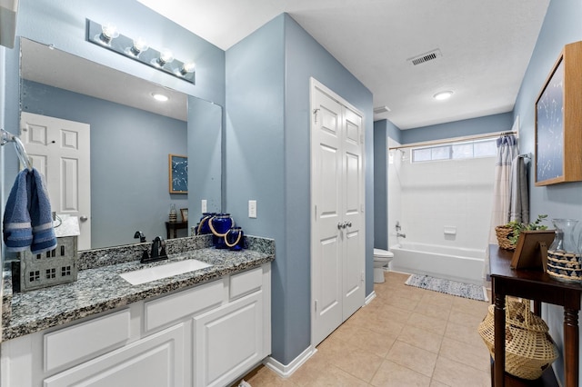 full bathroom featuring tile patterned floors, vanity, toilet, and shower / bath combo