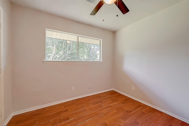 empty room featuring ceiling fan and light hardwood / wood-style flooring