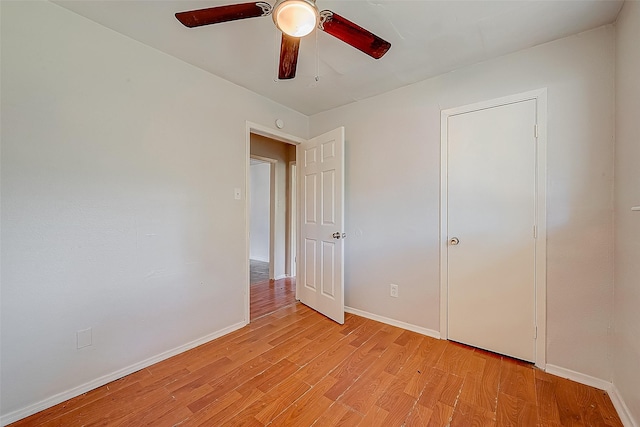 unfurnished bedroom with light hardwood / wood-style floors and ceiling fan