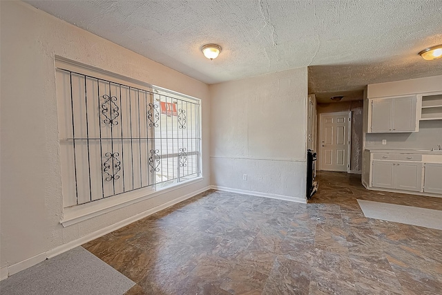 interior space with a textured ceiling