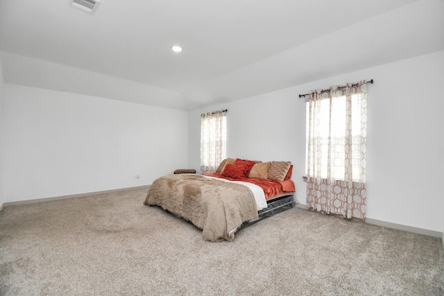 bedroom featuring carpet flooring and lofted ceiling