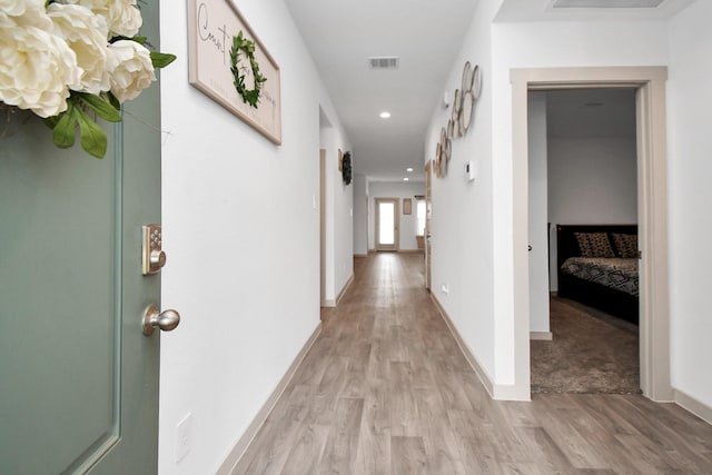 hallway featuring light hardwood / wood-style flooring