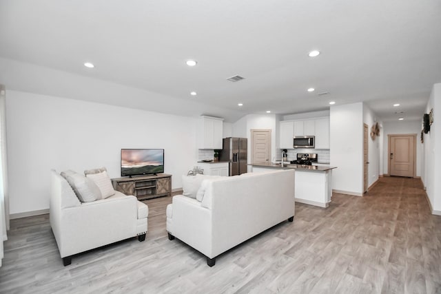 living room with light hardwood / wood-style floors