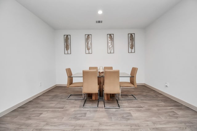 dining space featuring light hardwood / wood-style floors