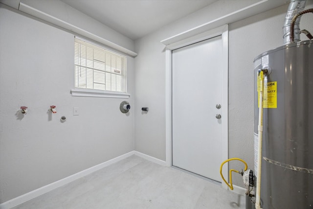 clothes washing area with gas water heater