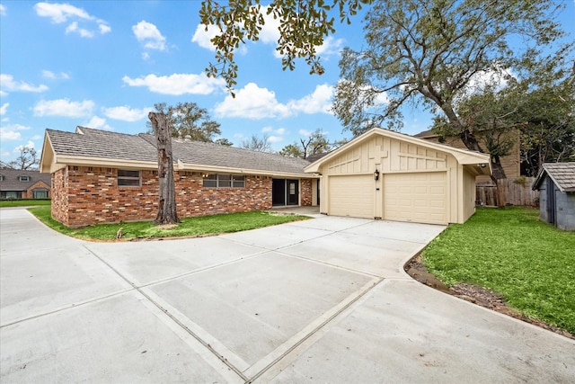 single story home featuring a garage and a front lawn