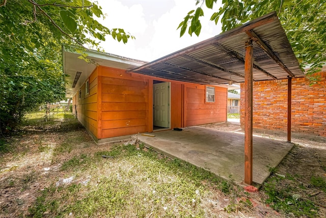 exterior space with a carport