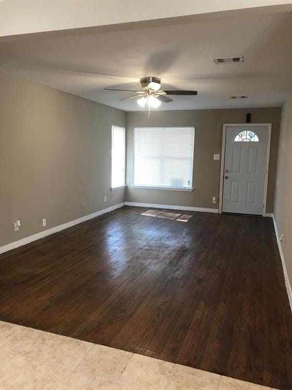 entrance foyer with ceiling fan and dark hardwood / wood-style flooring