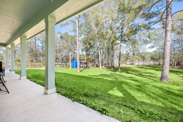 view of yard featuring a patio and fence