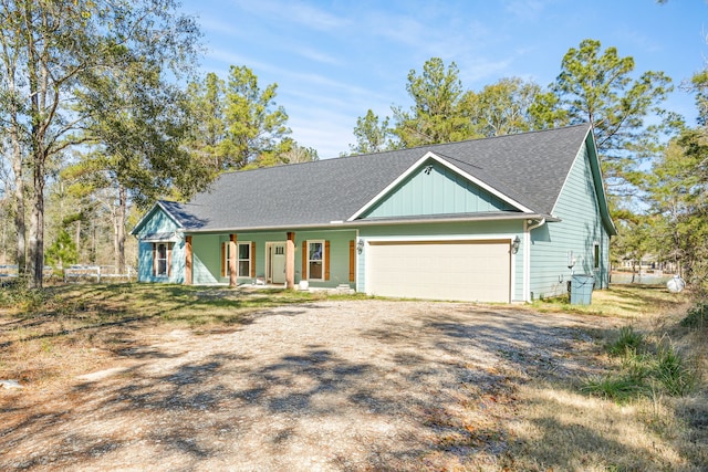 view of front of property with a porch and a garage