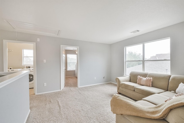 living room with light colored carpet