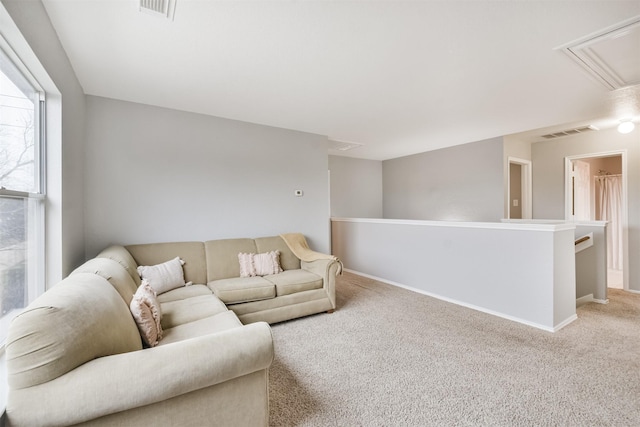 living room featuring light carpet