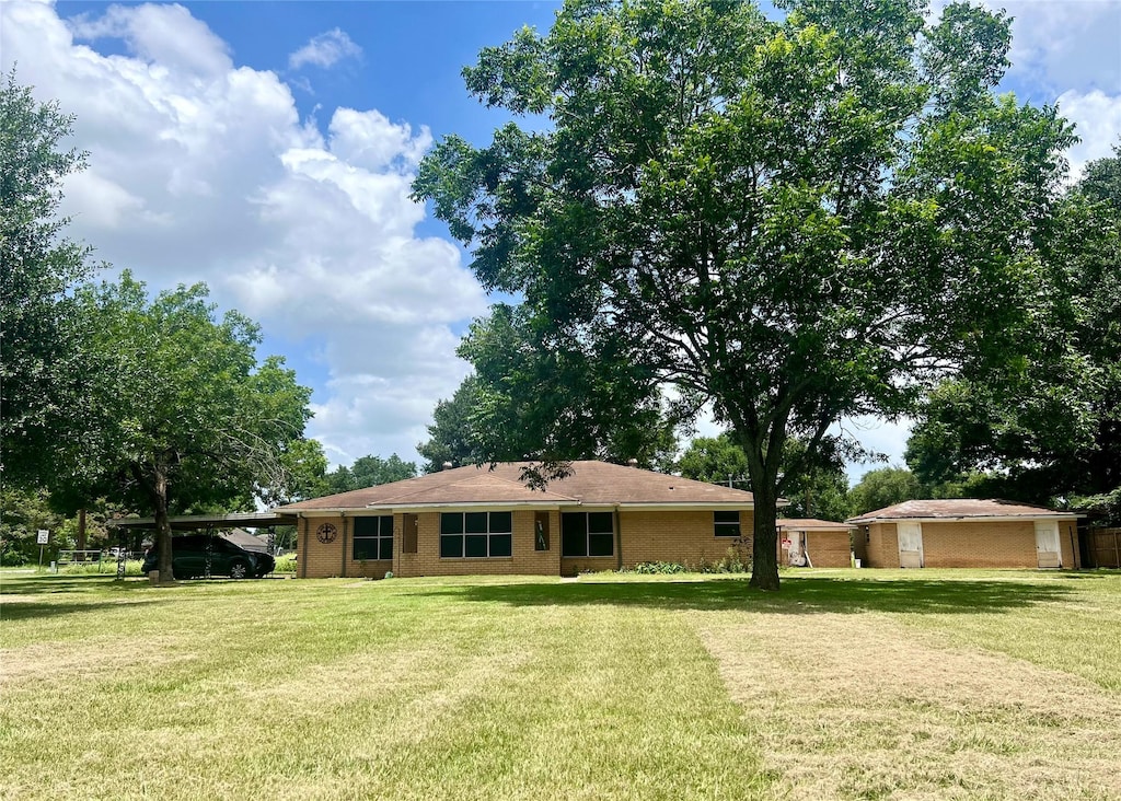1234 Frydek Rd, Sealy, TX 77474 - single story home with a carport and a front yard