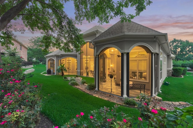 exterior space with a yard and french doors