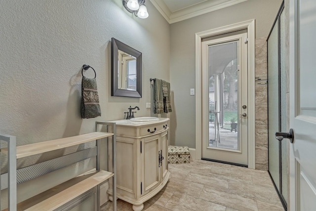 bathroom with vanity and ornamental molding