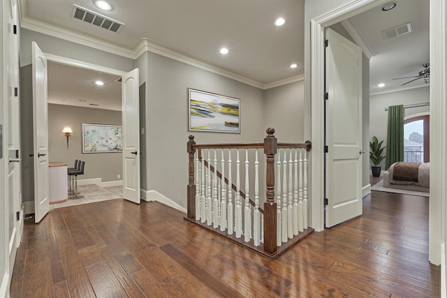 hall featuring crown molding and dark hardwood / wood-style floors