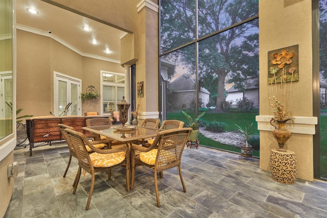 interior space with a high ceiling and ornamental molding