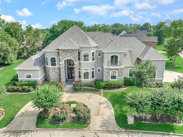 french country home with a front yard