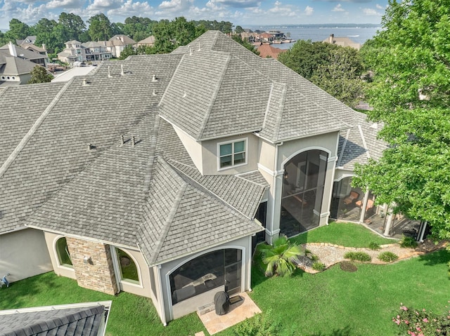 birds eye view of property featuring a water view