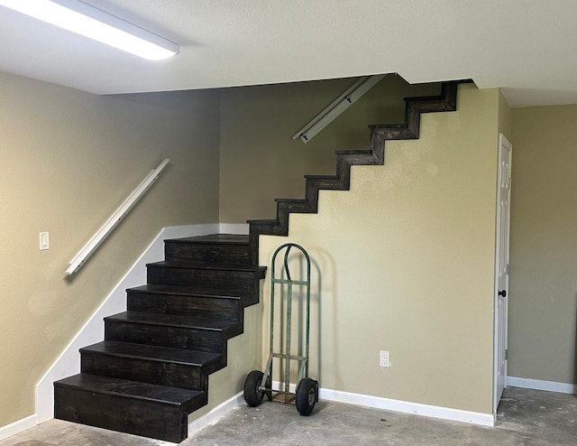 stairway with concrete floors