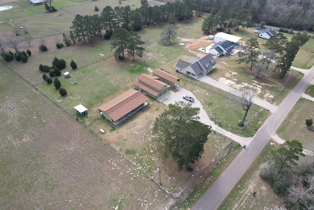 birds eye view of property with a rural view