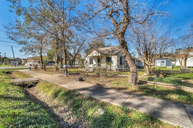 713 Firnat St, Houston, TX 77022 - exterior space featuring a fenced front yard and a residential view