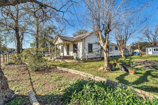 view of property exterior with a yard