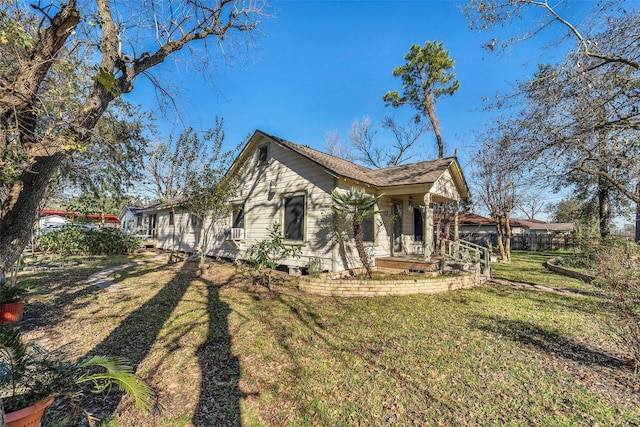 713 Firnat St, Houston, TX 77022 - view of side of property featuring a lawn