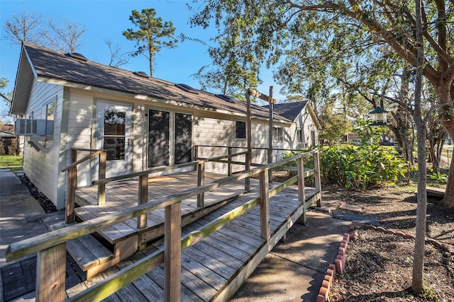 713 Firnat St, Houston, TX 77022 - back of property with a wooden deck, a shingled roof, and cooling unit