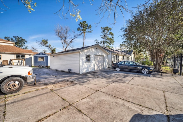 view of property exterior with an outbuilding