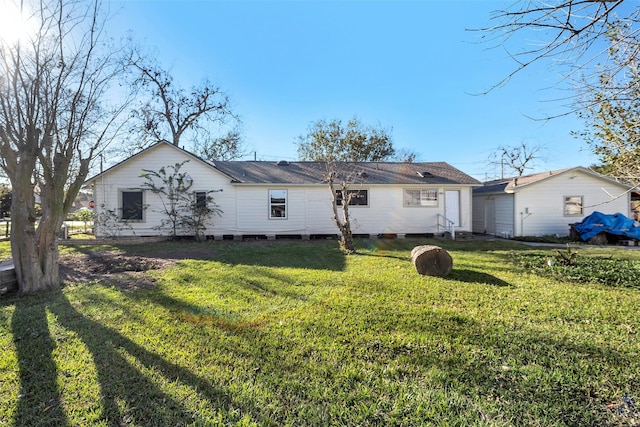 back of house with a yard