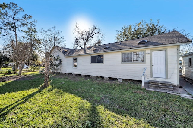 713 Firnat St, Houston, TX 77022 - back of property featuring a lawn