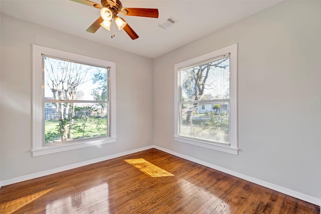 unfurnished room featuring ceiling fan and hardwood / wood-style flooring