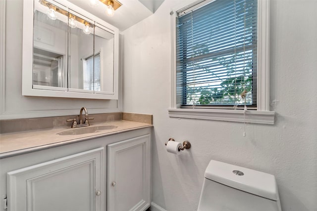 713 Firnat St, Houston, TX 77022 - half bathroom featuring vanity and toilet
