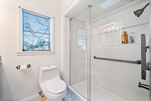 bathroom with tile patterned floors, an enclosed shower, and toilet