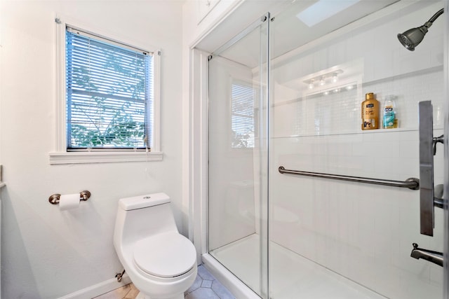 713 Firnat St, Houston, TX 77022 - full bath featuring toilet, a stall shower, and baseboards