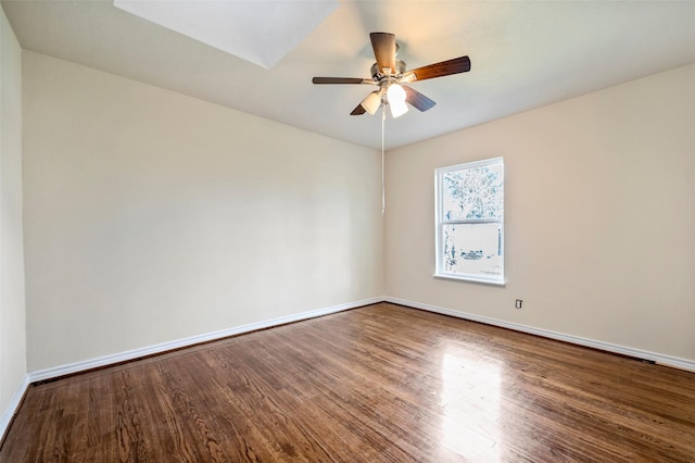 empty room featuring hardwood / wood-style flooring and ceiling fan