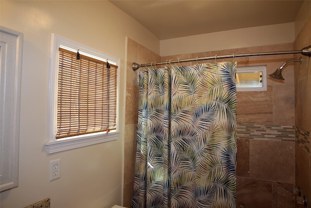 bathroom with a shower with shower curtain