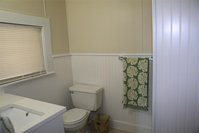 bathroom featuring vanity and toilet