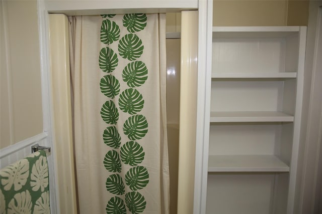 bathroom featuring built in shelves