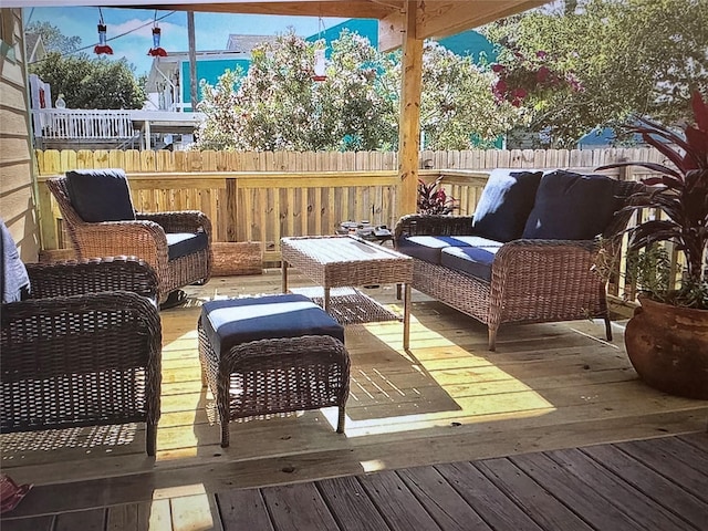 wooden deck featuring outdoor lounge area