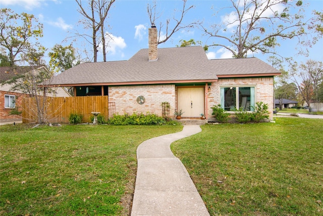 single story home featuring a front yard