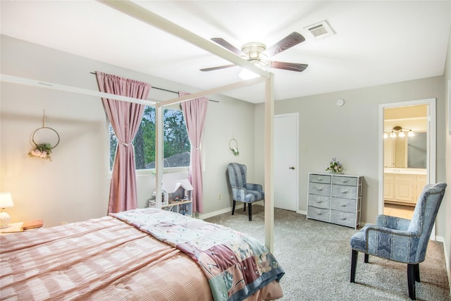 bedroom with light carpet, connected bathroom, and ceiling fan